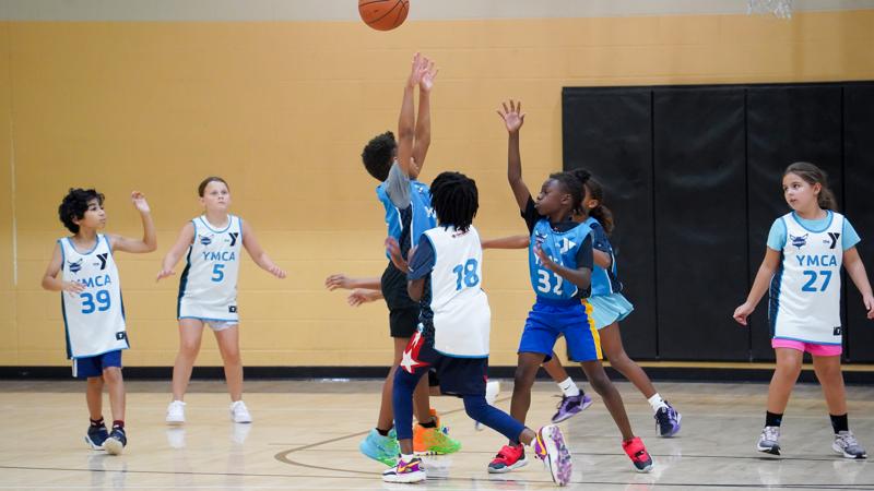 Youth playing indoor basketball at the Morrison YMCA
