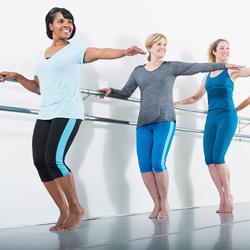group-exercise-dance A group of young adults doing aerobic exercise in a bicycle spinning class.