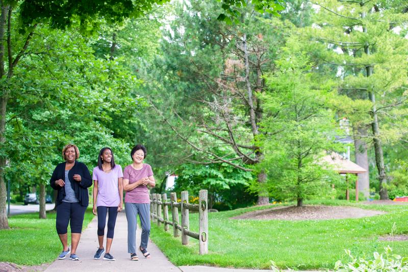 Three women walking outside