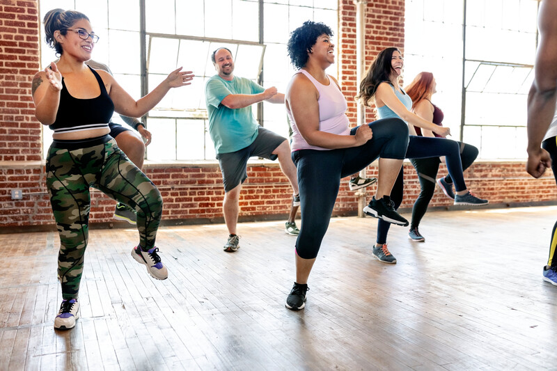 Diverse people in an active dance class